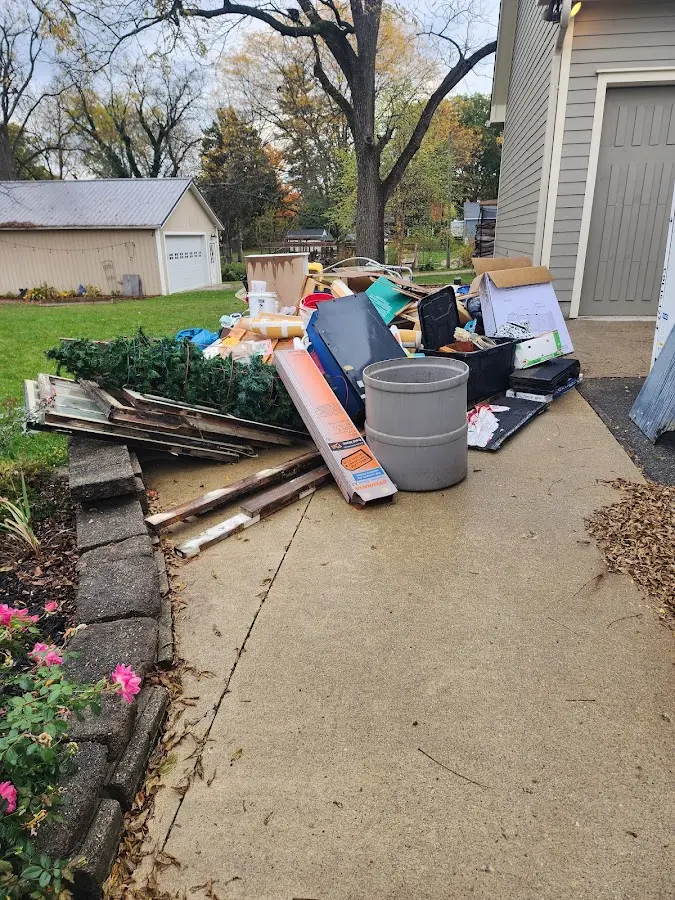 Dumpster being loaded with debris for 3 Yard Dumpster Rental in Carolina Forest